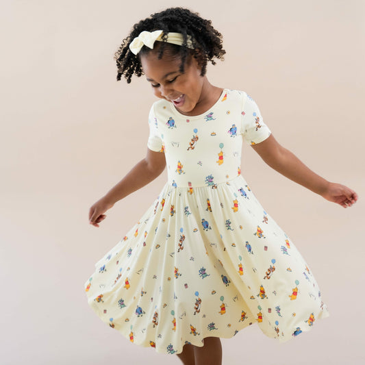 Kyte Baby Twirl Dress in Winnie the Pooh Celebration