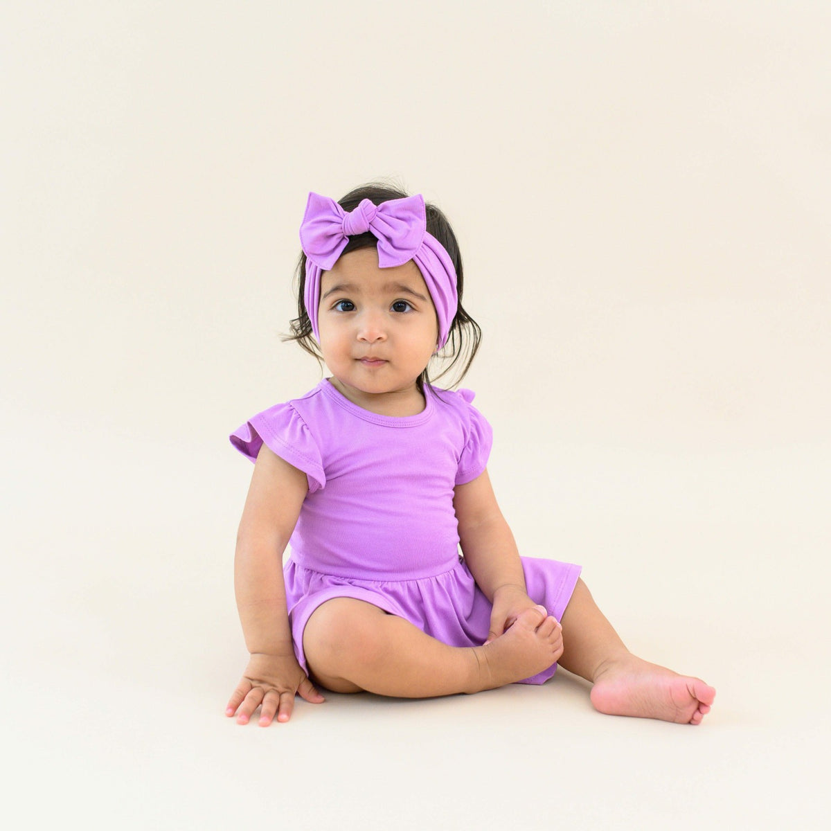 Kyte Baby Twirl Bodysuit Dress in Poi