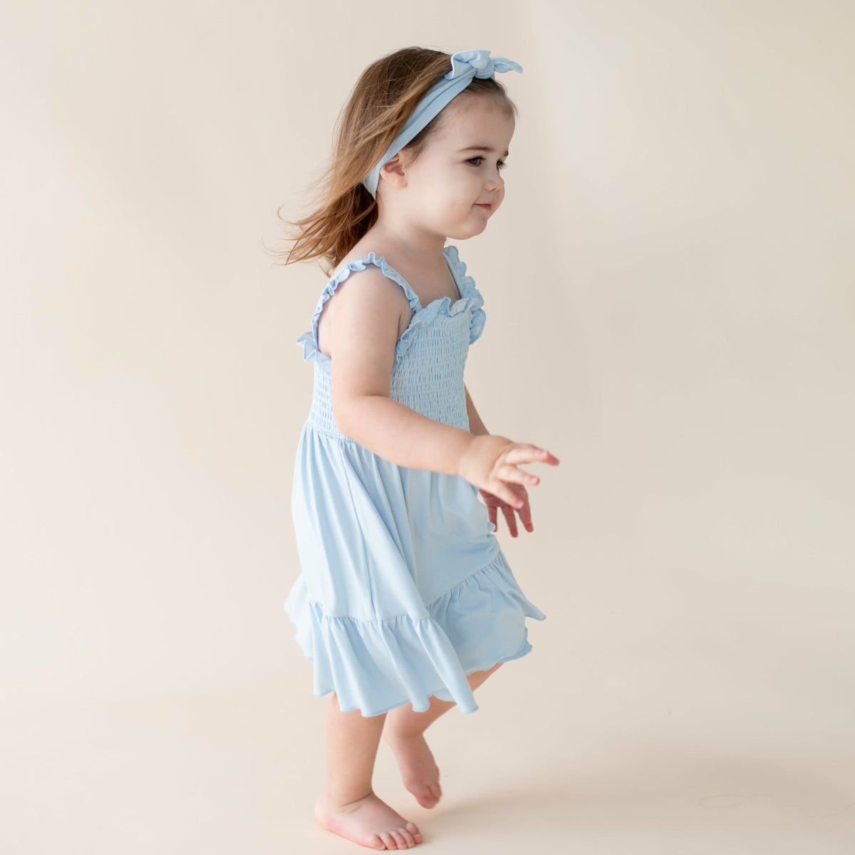 Kyte Baby Smocked Dress in Breeze