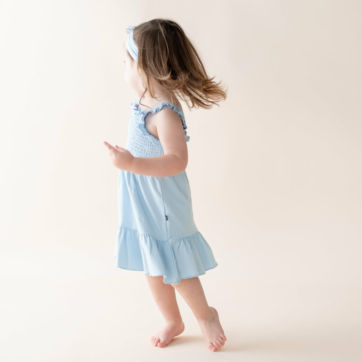 Kyte Baby Smocked Dress in Breeze