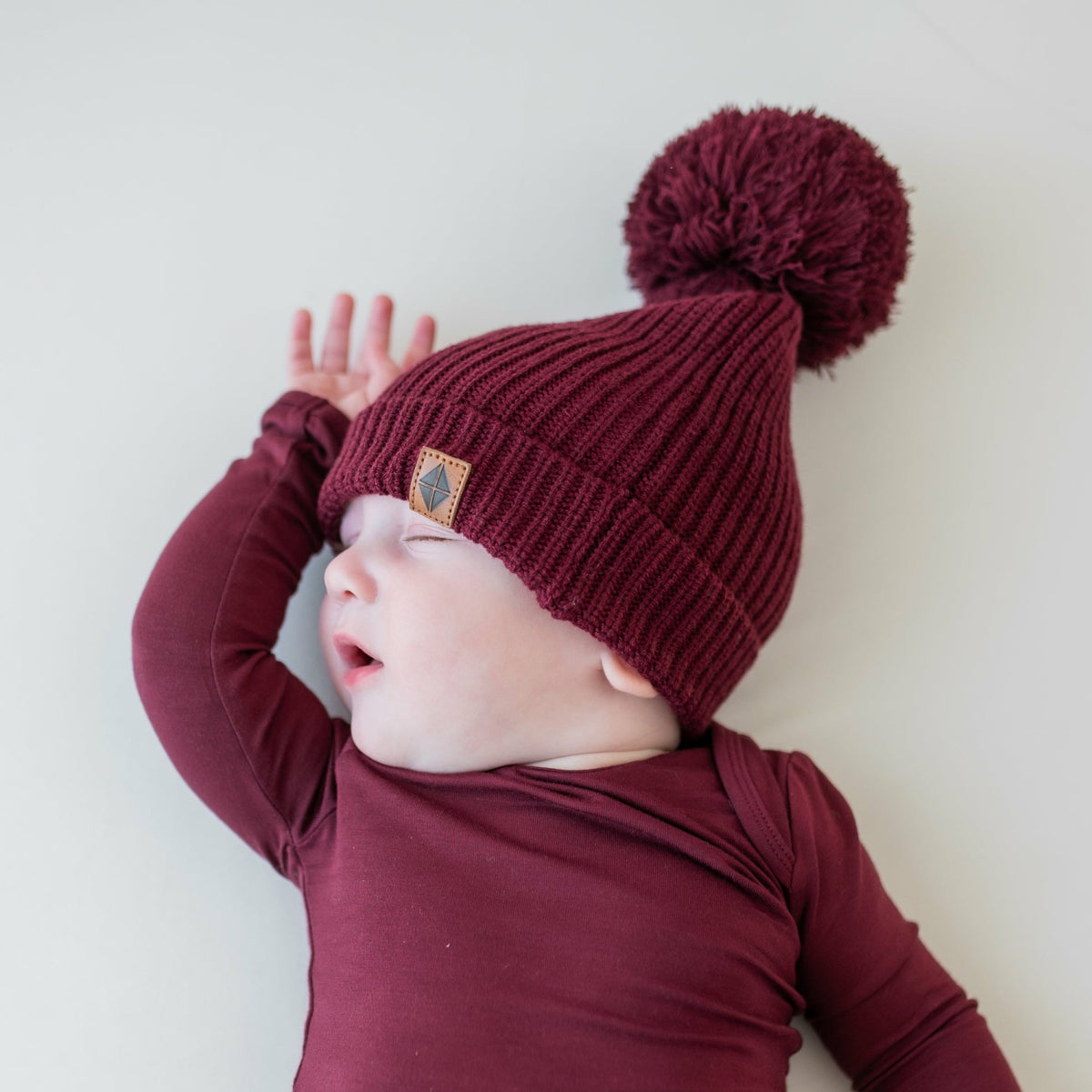 Kyte Baby Chunky Knit Pom Beanie in Burgundy
