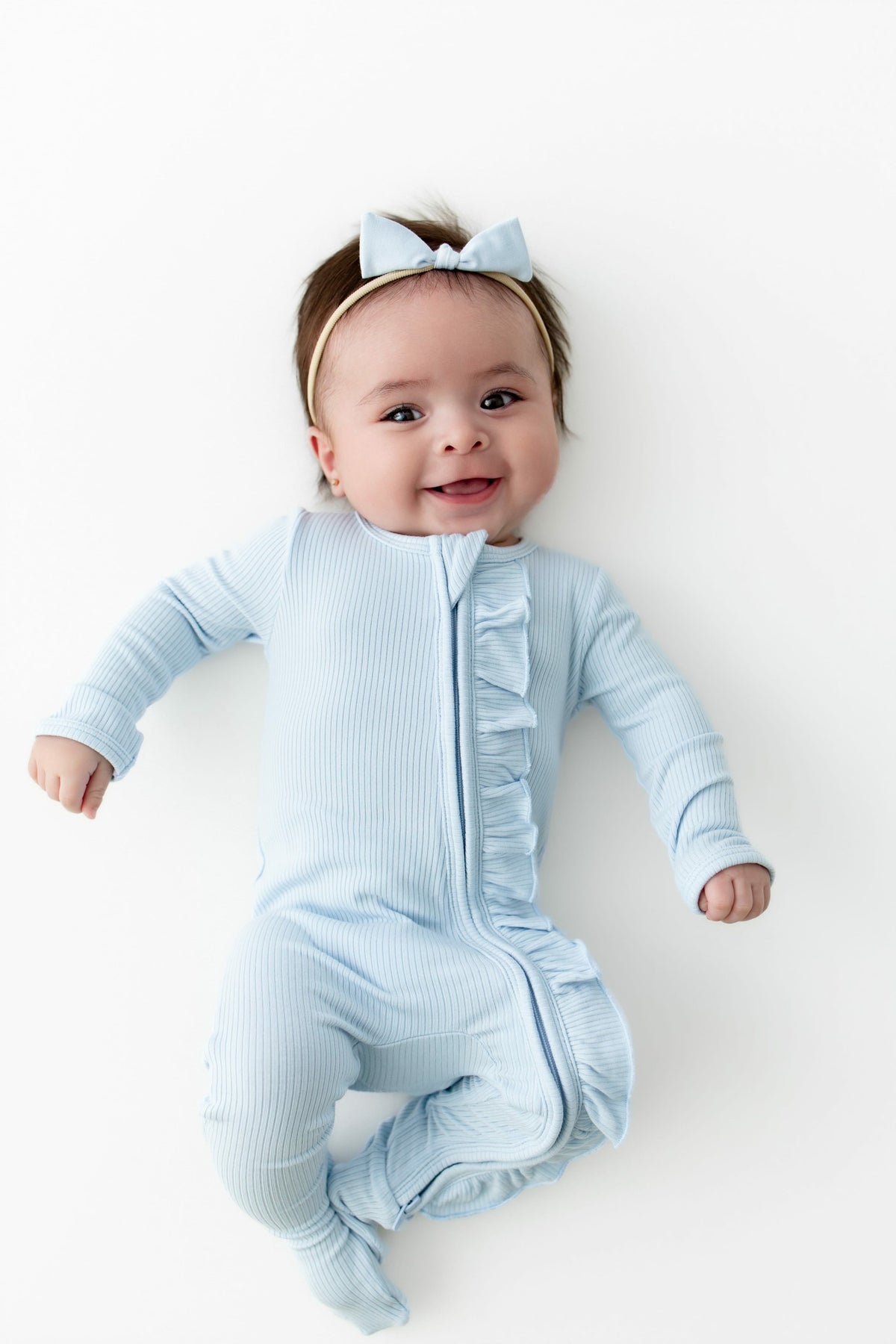 Kyte Baby Ribbed Ruffle Zipper Footie in Breeze