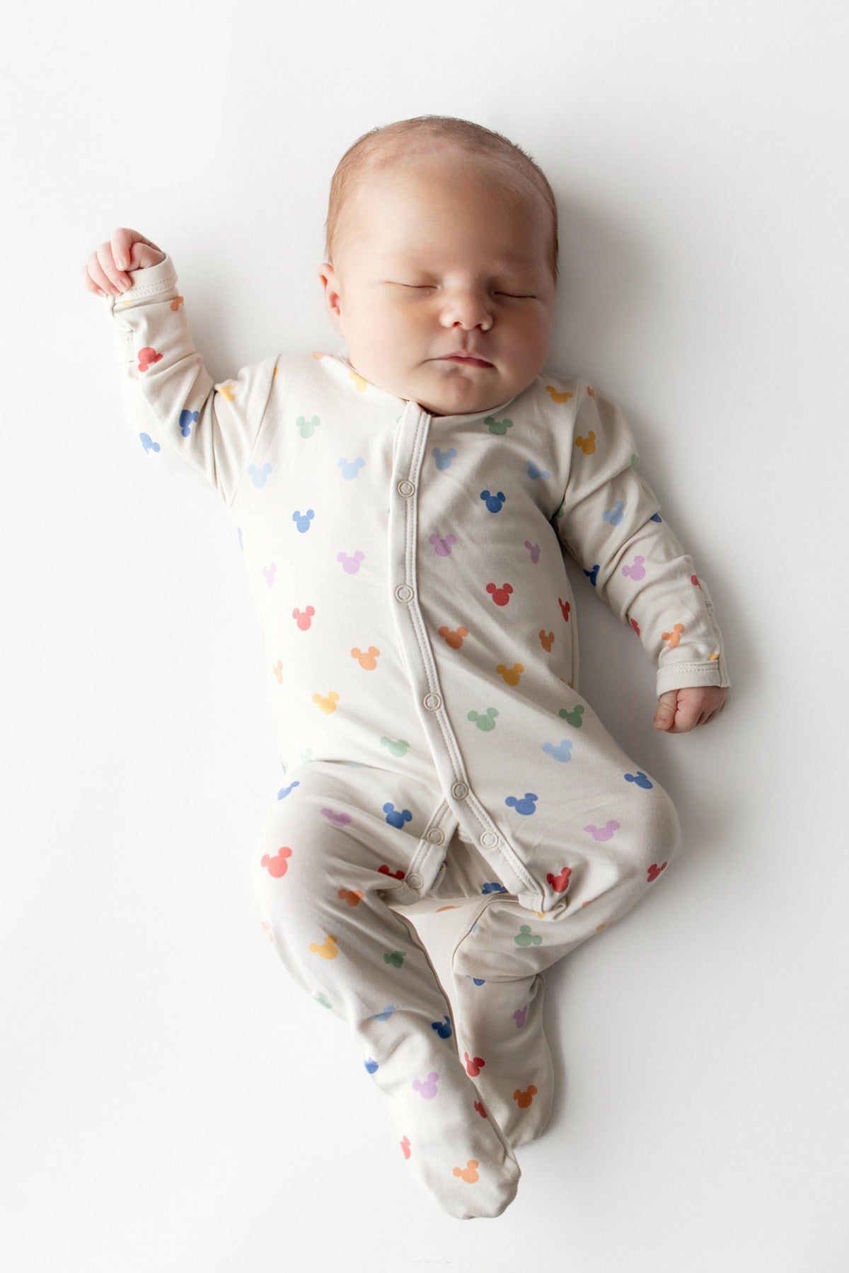 Kyte Baby Footie in Pastel Mickey Mouse
