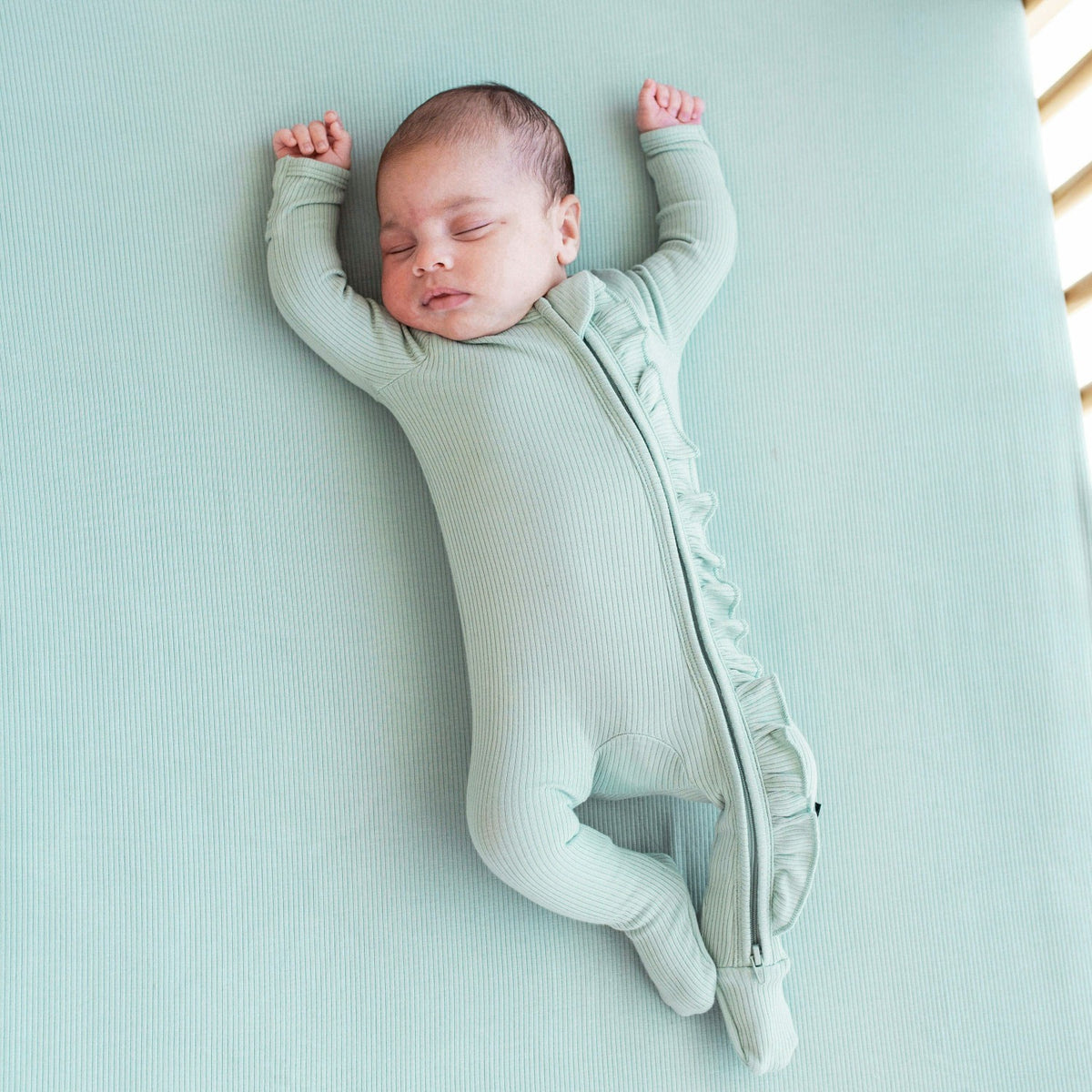 Kyte Baby Ribbed Ruffle Zipper Footie in Sage