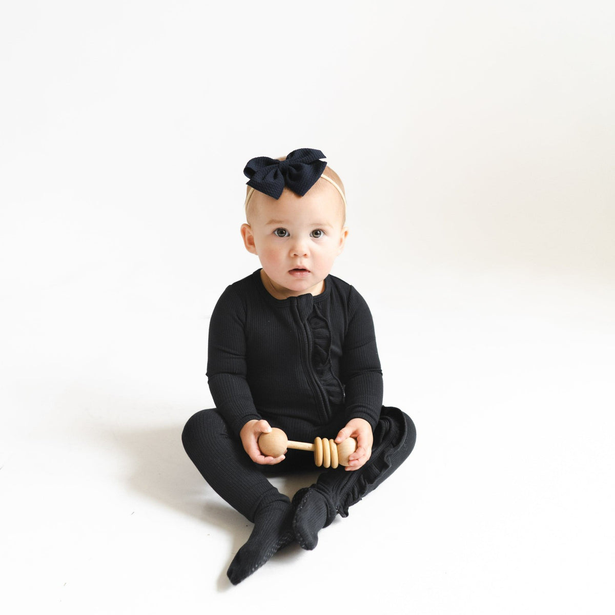 Kyte Baby Ribbed Ruffle Zipper Footie in Midnight