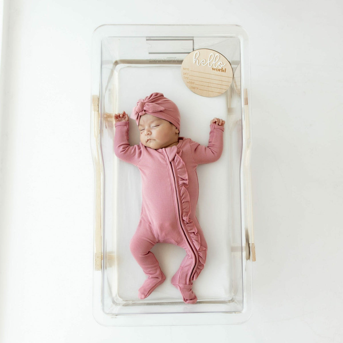 Kyte Baby Ribbed Ruffle Zipper Footie in Apple Blossom