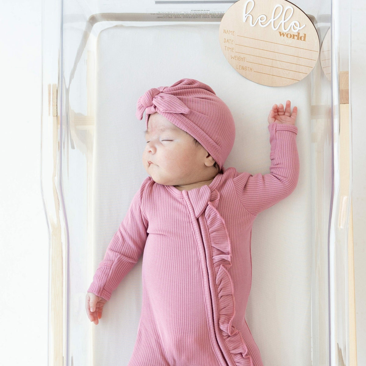 Kyte Baby Ribbed Ruffle Zipper Footie in Apple Blossom