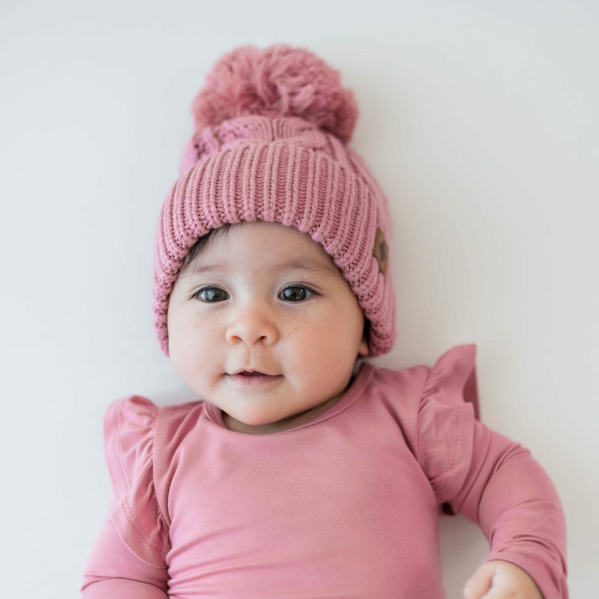 Kyte Baby Chunky Cable Knit Beanie in Apple Blossom
