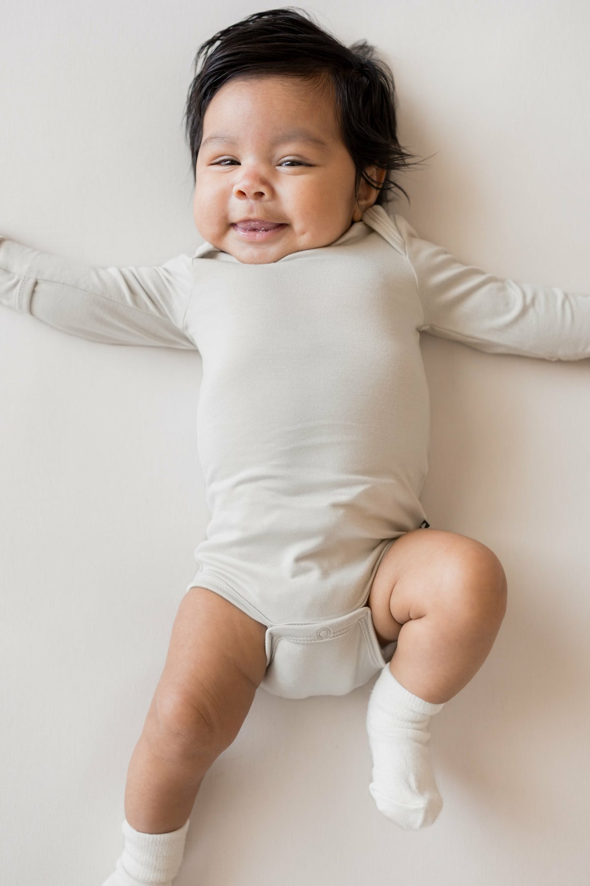 Kyte Baby Long Sleeve Bodysuit in Oat