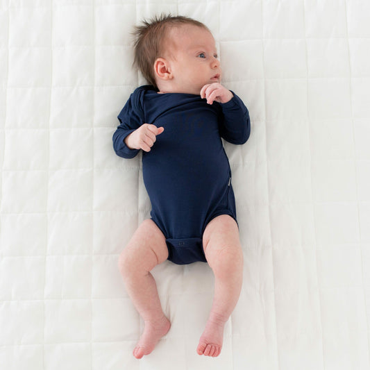 Kyte Baby Long Sleeve Bodysuit in Navy