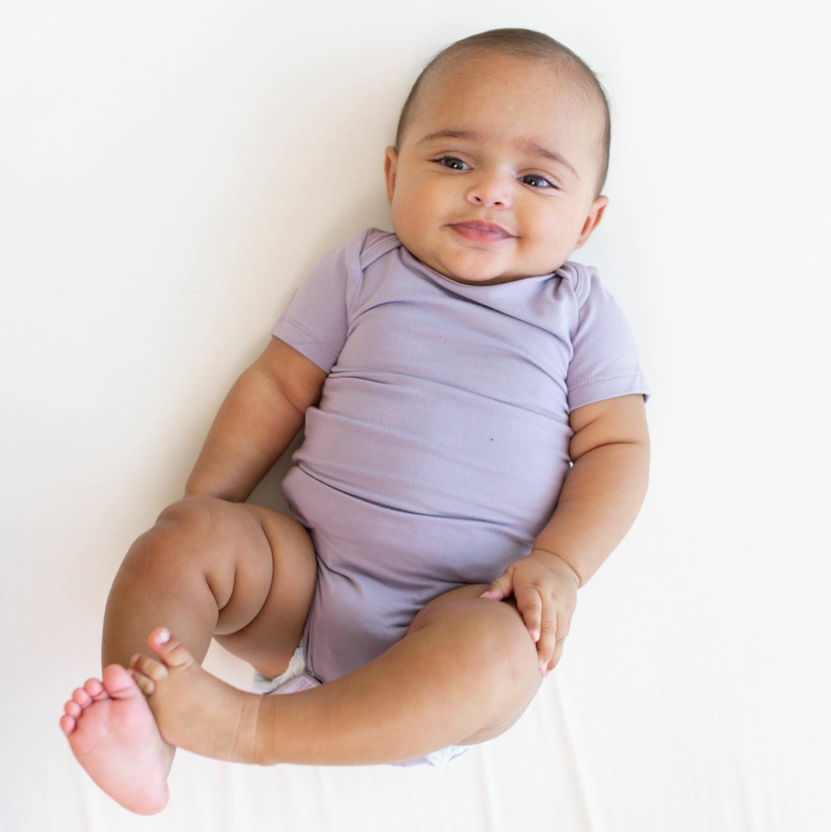 Kyte Baby Bodysuit in Taro