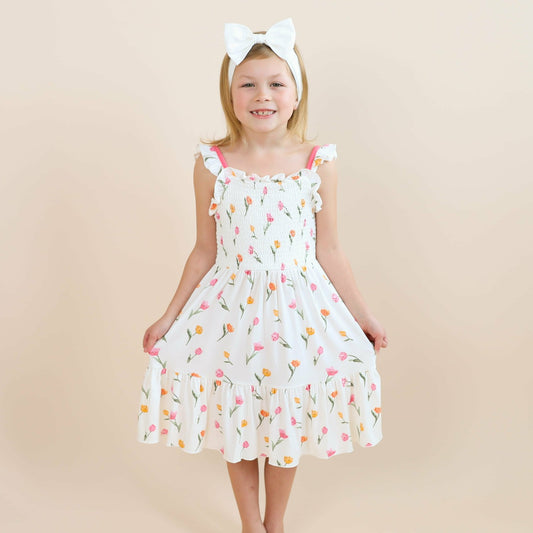 Kyte Baby Smocked Dress in Tulip