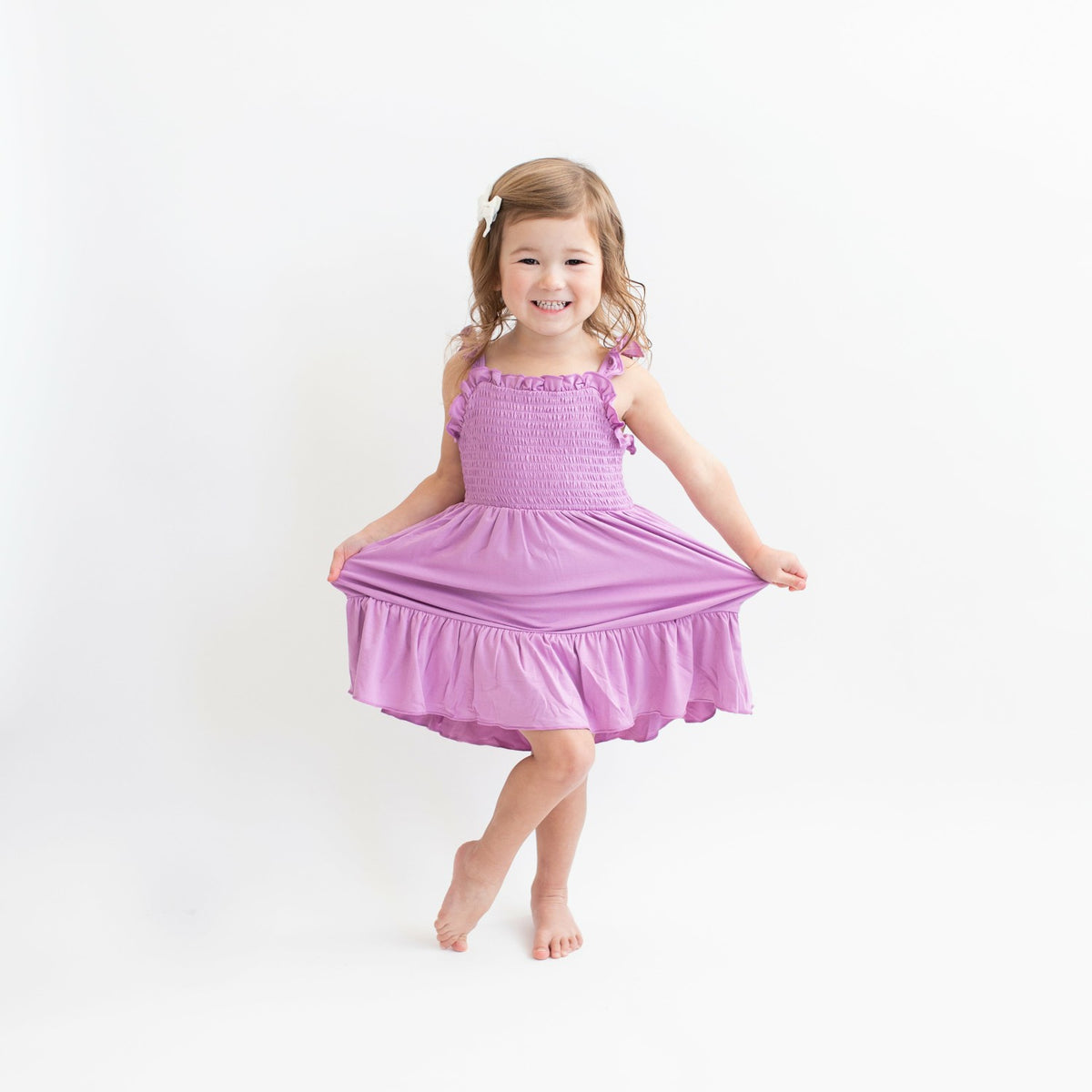 Kyte Baby Smocked Dress in Poi