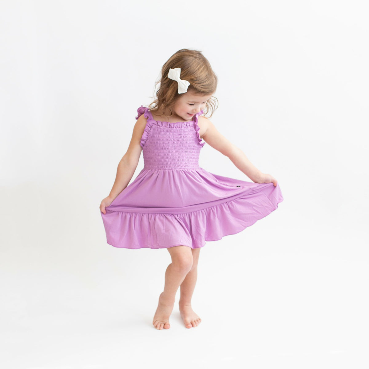 Kyte Baby Smocked Dress in Poi