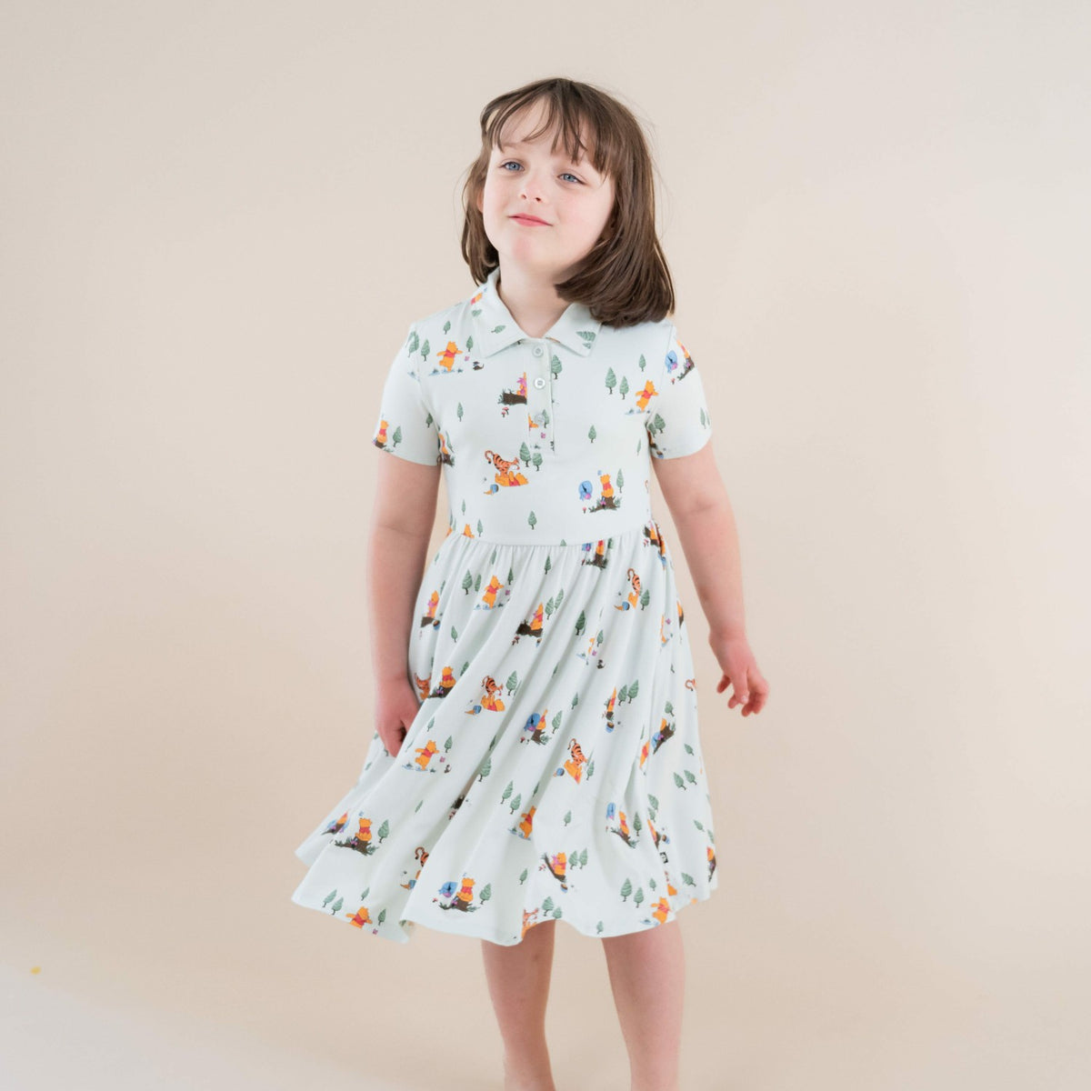 Kyte Baby Polo Dress in Winnie the Pooh Hundred Acre Wood