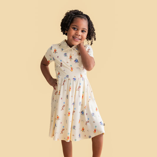 Kyte Baby Polo Dress in Winnie the Pooh Celebration