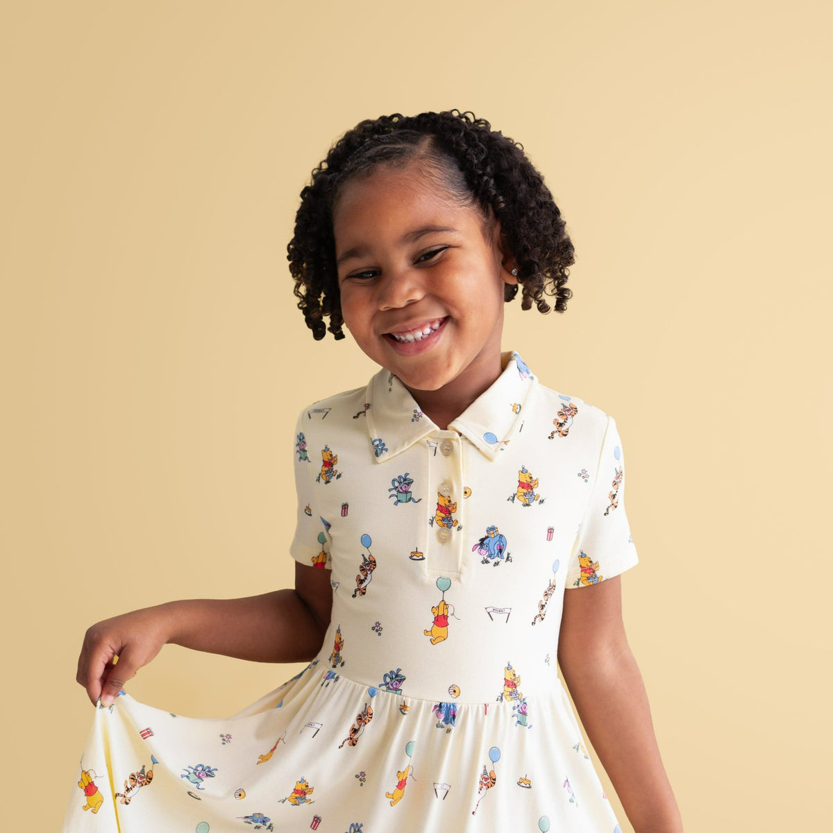 Kyte Baby Polo Dress in Winnie the Pooh Celebration