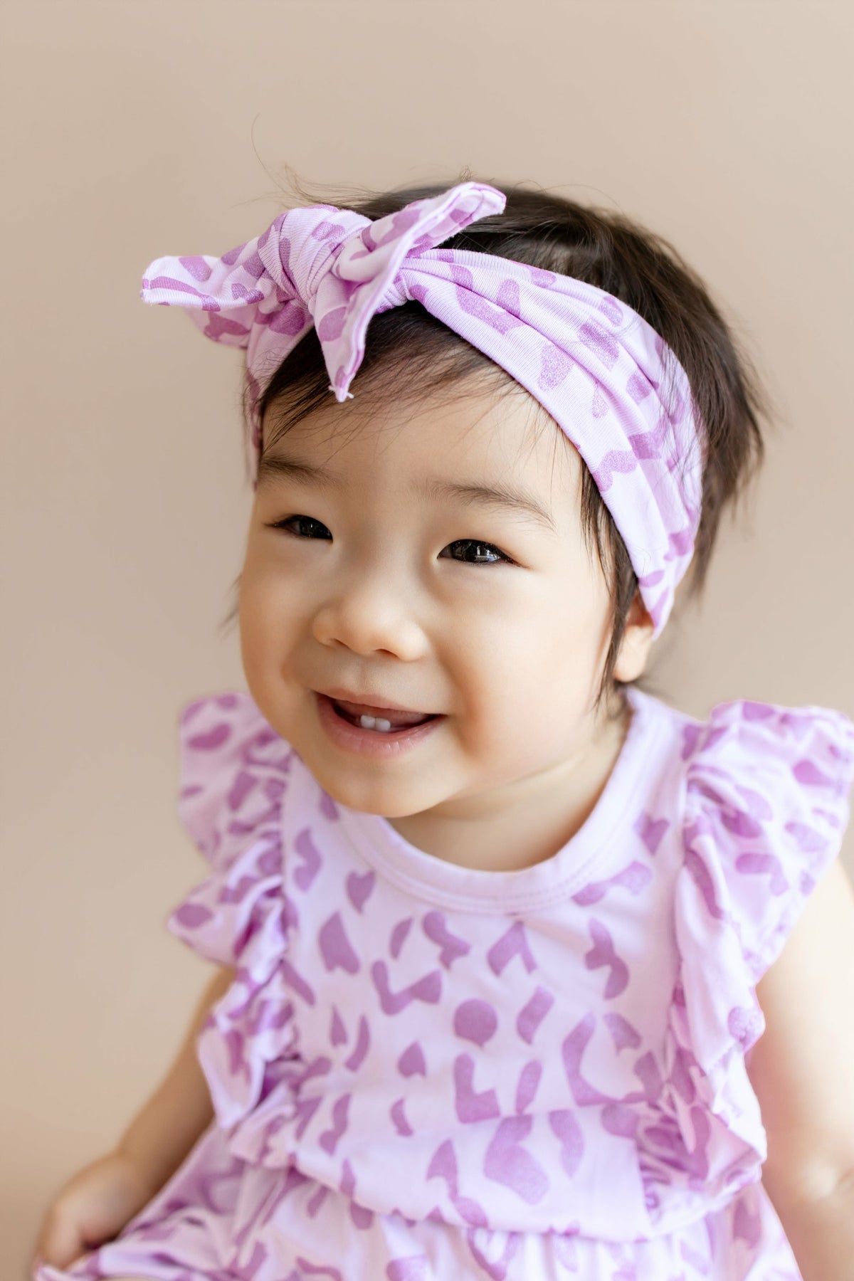 Kyte Baby Bubble Romper in Thistle Leopard