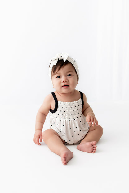 Kyte Baby Smocked Bubble Romper in Midnight Polka Dot
