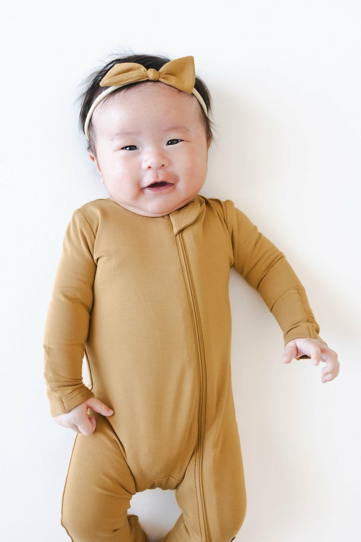 Kyte Baby Zippered Romper in Ochre