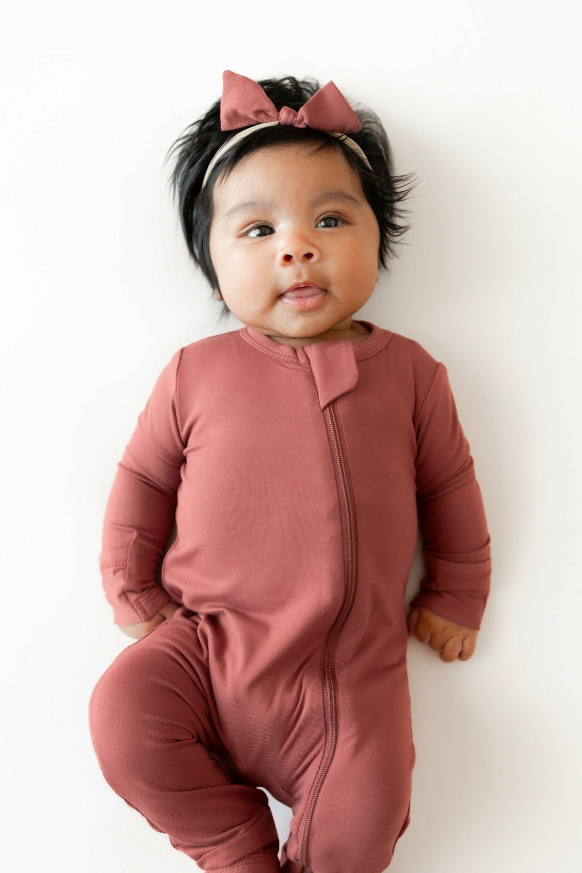 Kyte Baby Zippered Romper in Ember