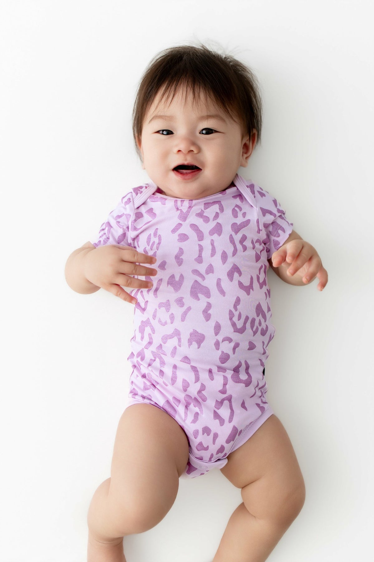 Kyte Baby Bodysuit in Thistle Leopard
