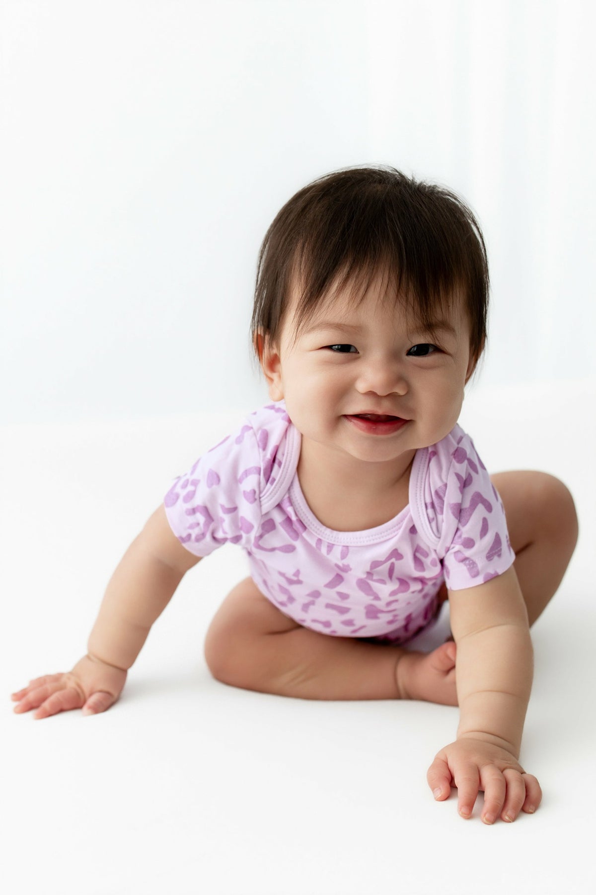 Kyte Baby Bodysuit in Thistle Leopard