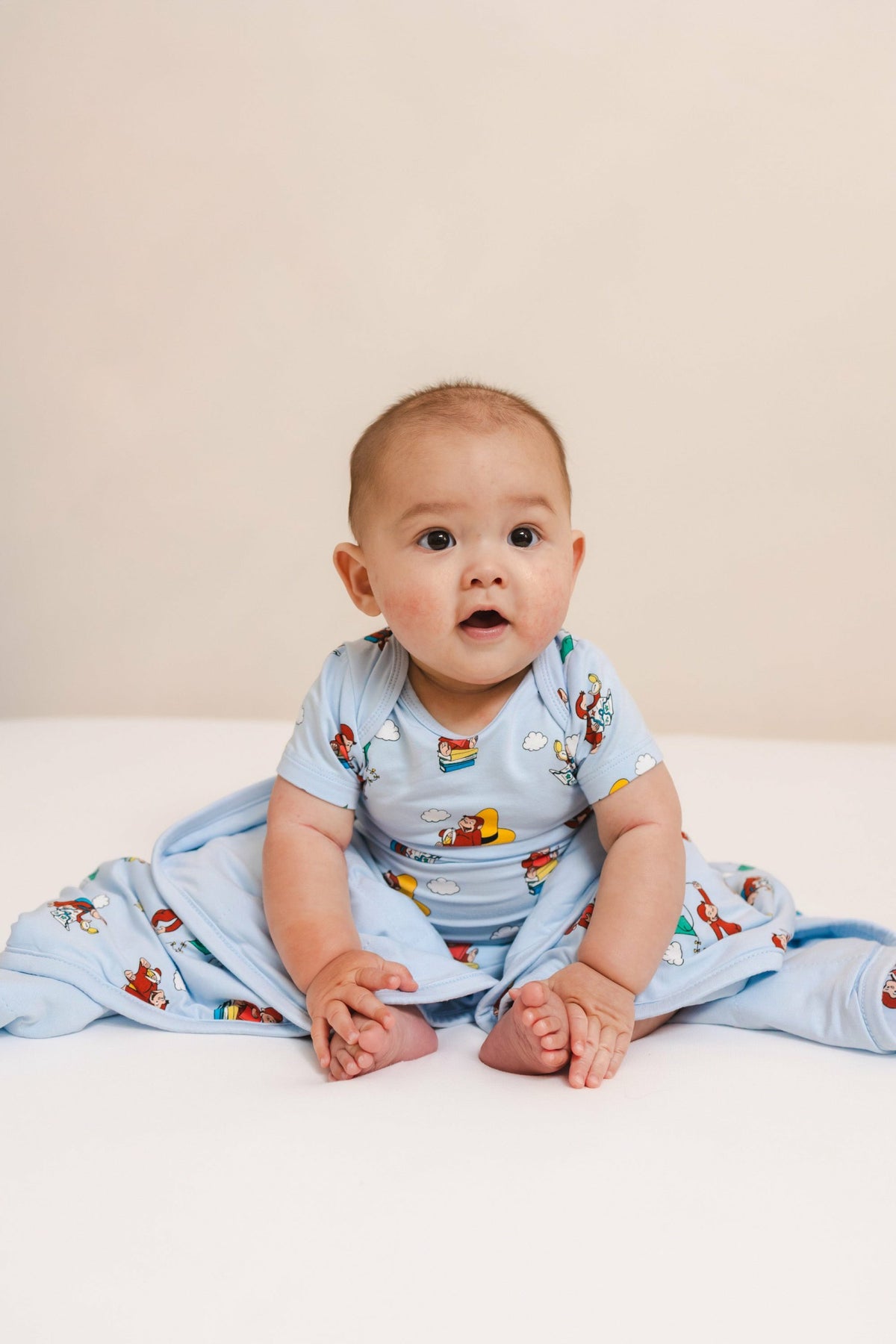 Kyte Baby Bodysuit in Curious George