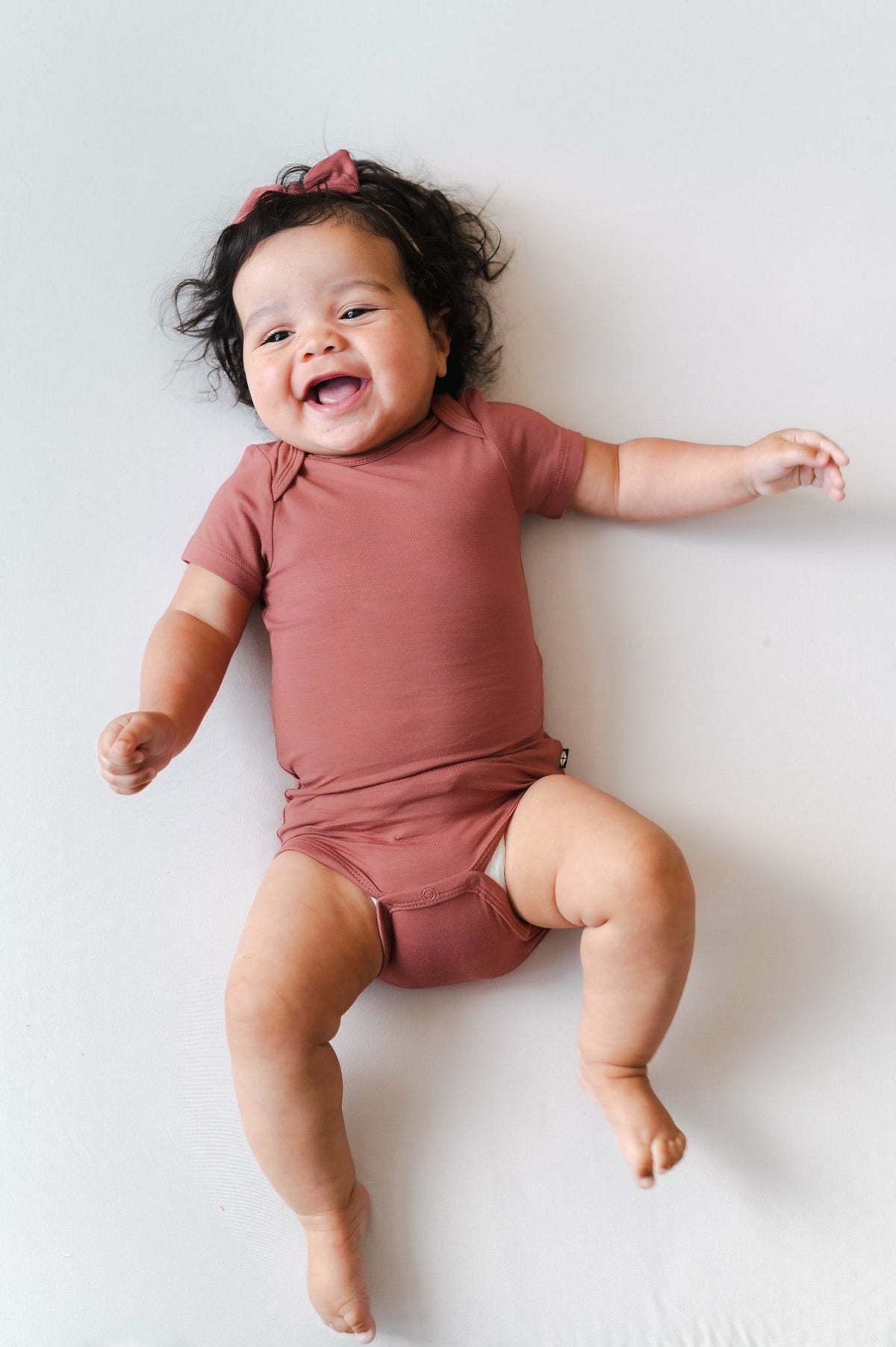 Kyte Baby Bodysuit in Ember