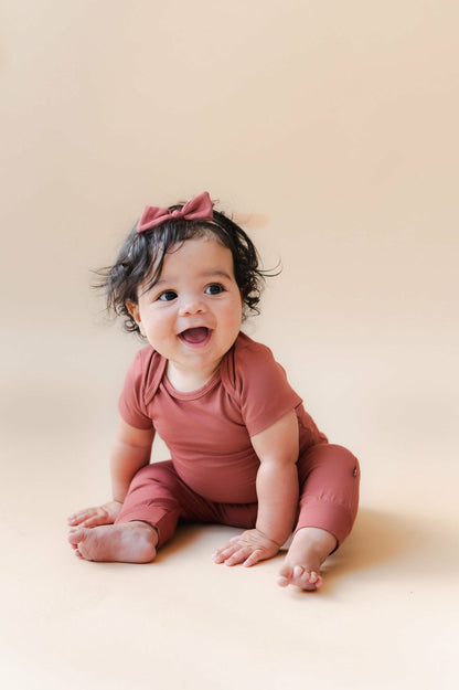 Kyte Baby Bodysuit in Ember