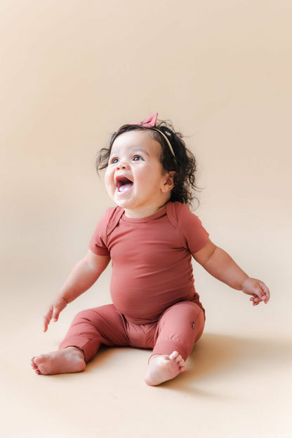 Kyte Baby Bodysuit in Ember
