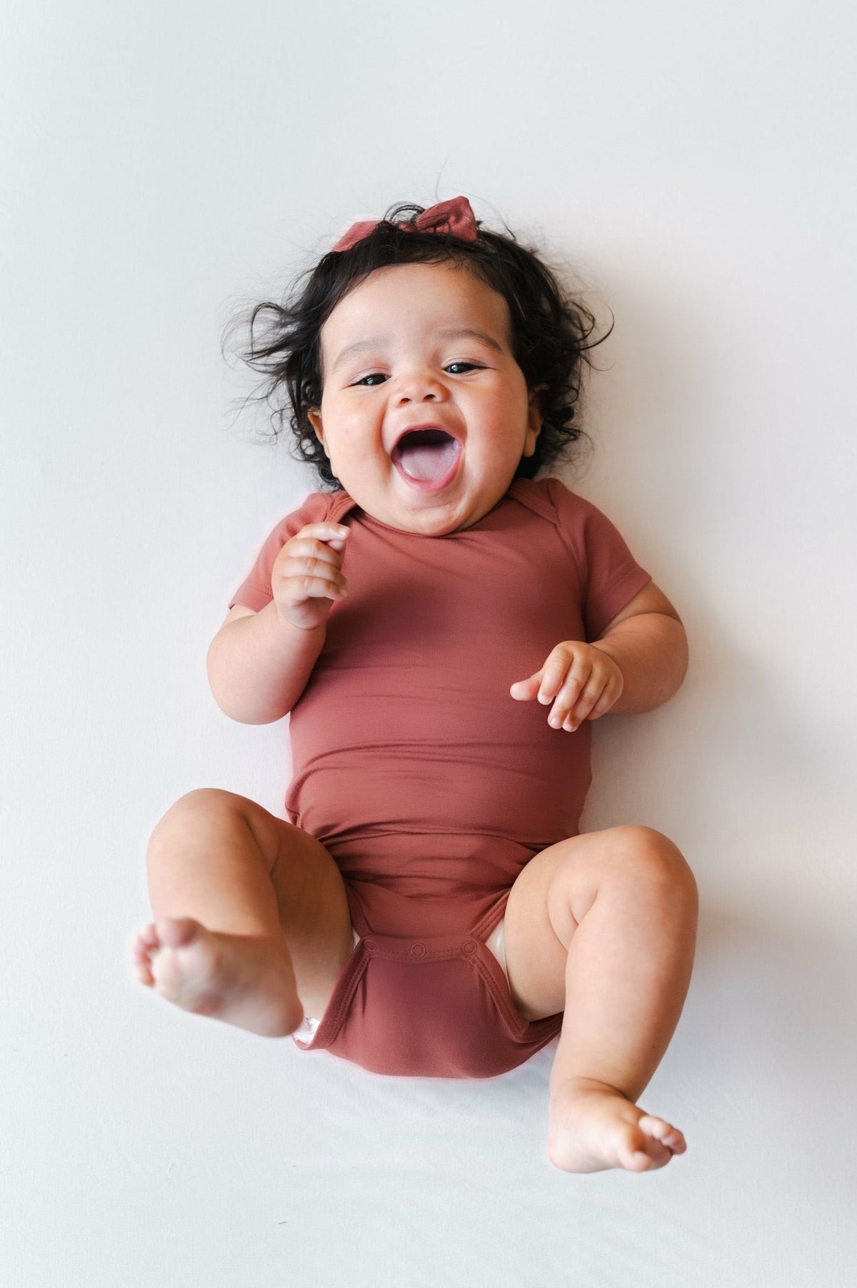 Kyte Baby Bodysuit in Ember
