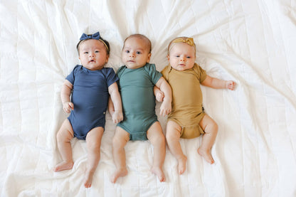 Kyte Baby Bodysuit in Ochre