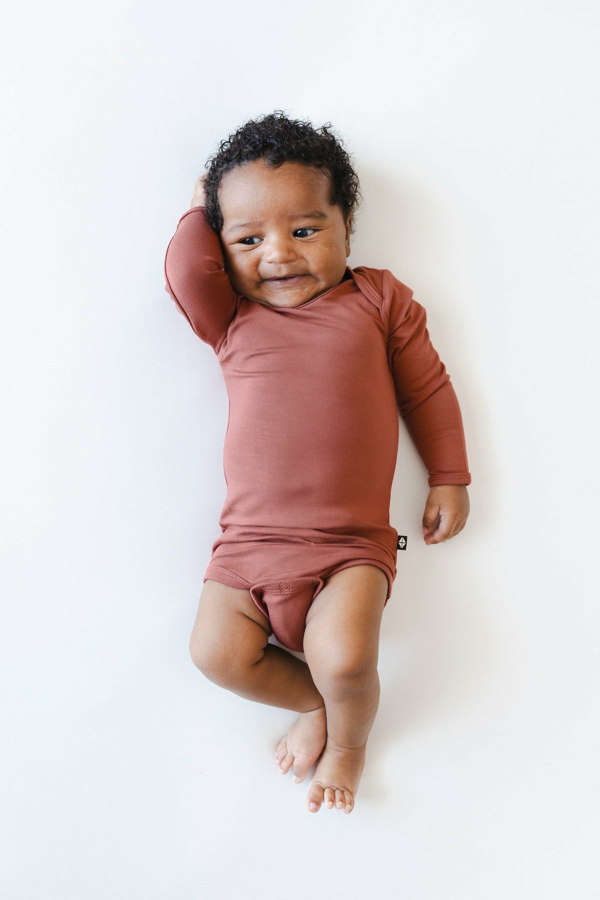 Kyte Baby Long Sleeve Bodysuit in Ember