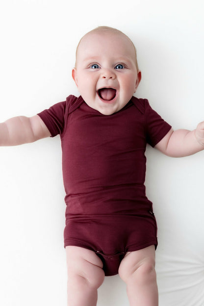 Kyte Baby Bodysuit in Burgundy