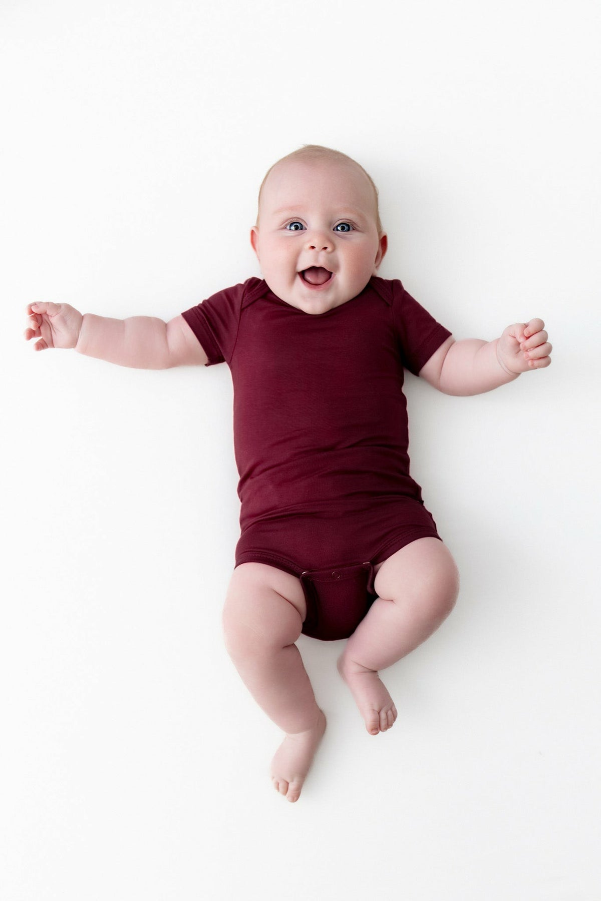 Kyte Baby Bodysuit in Burgundy