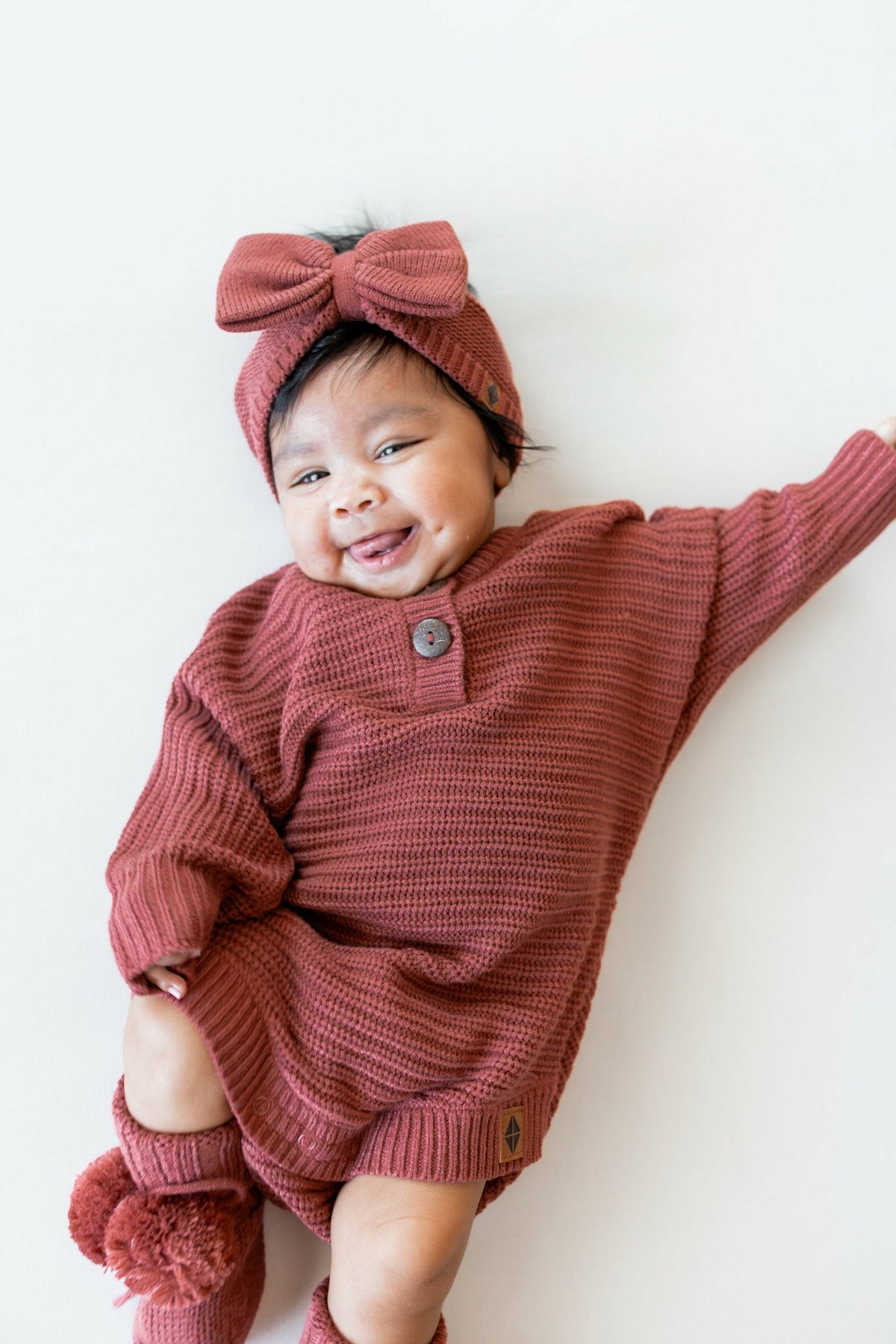 Kyte Baby Chunky Knit Romper in Ember